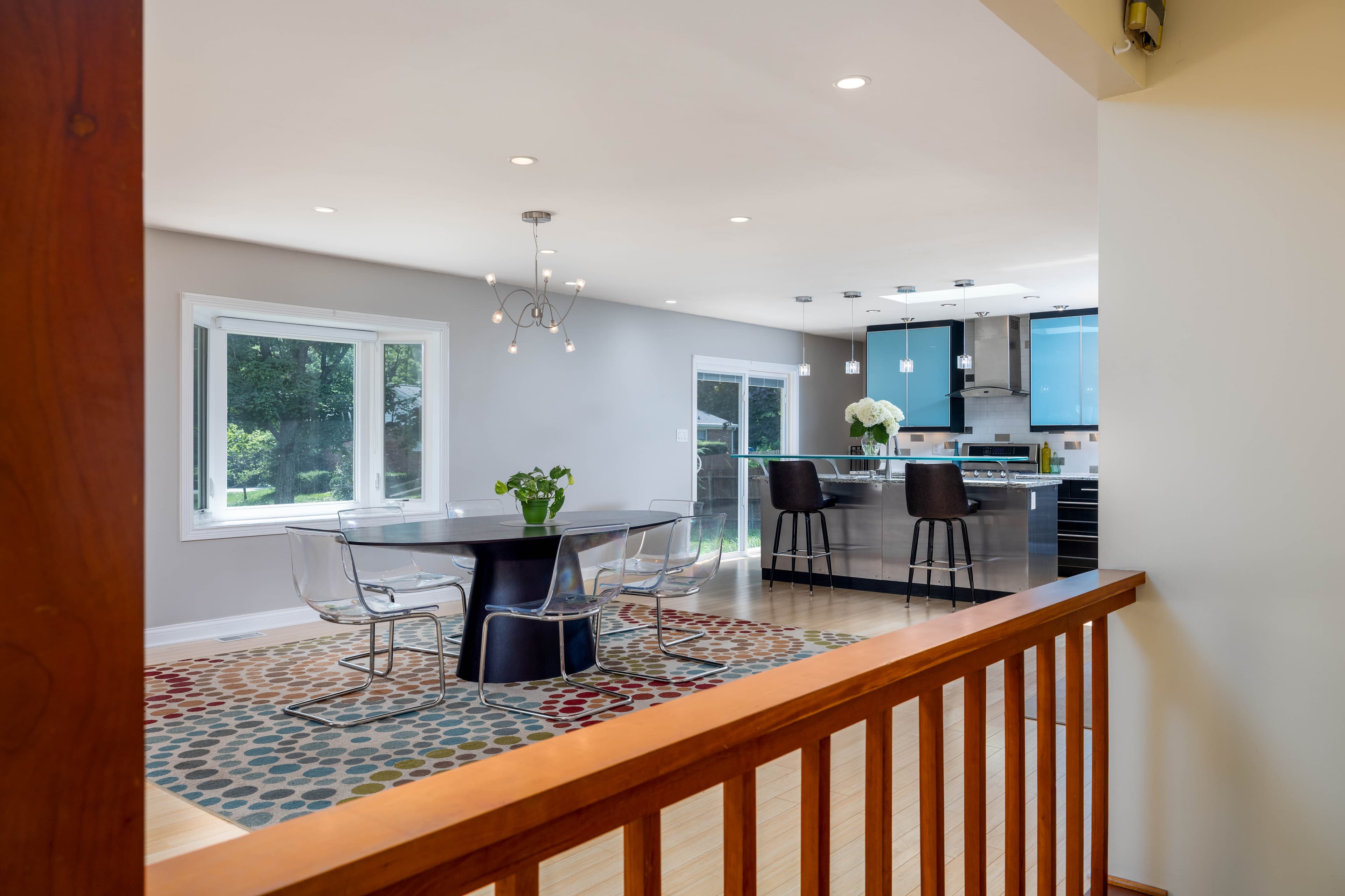 Open-plan dining area and kitchen with blue cabinetry
